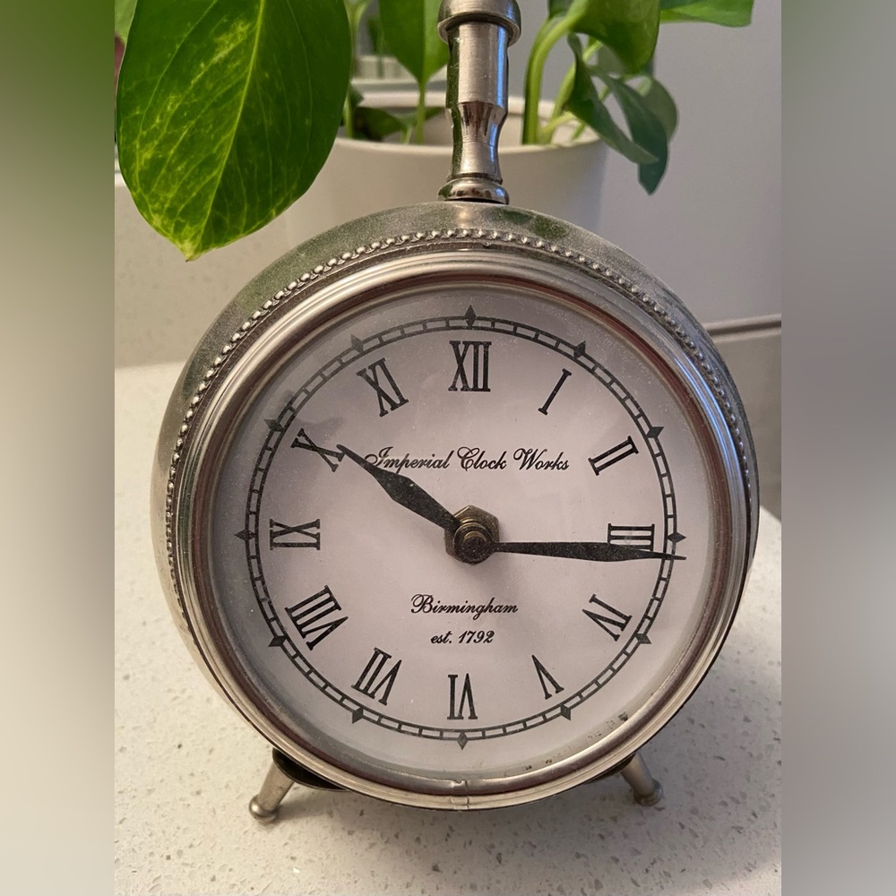 Beautiful silver colour old fashioned alarm clock decor